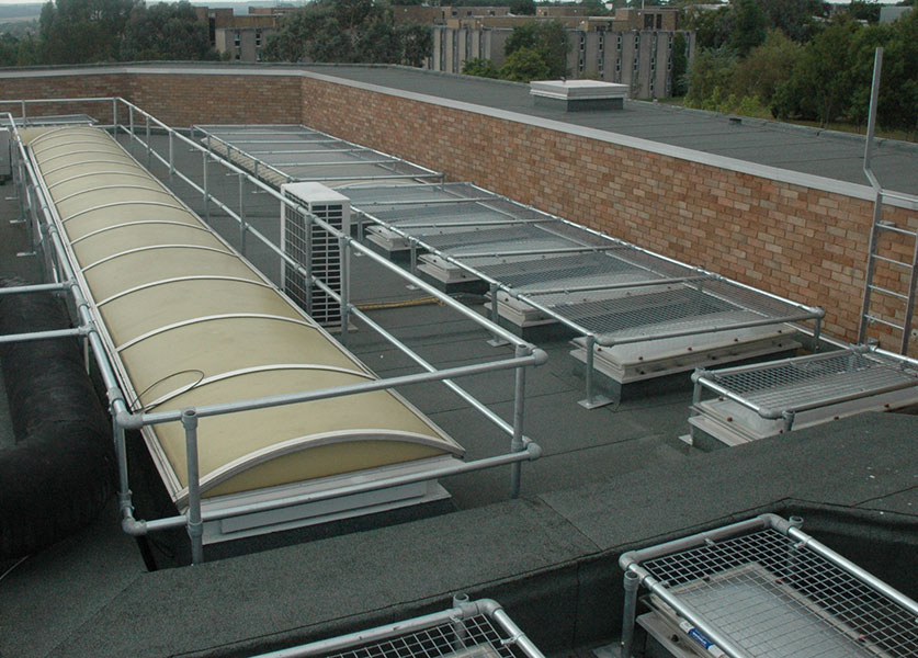 Freestanding modular rooflight covers over different sized rooflights on a large roof