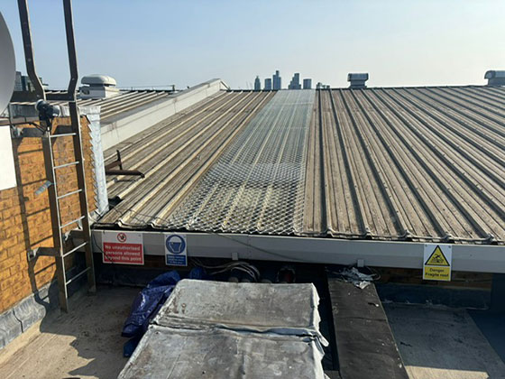 Rooflight protection cover on an metal profile roof.