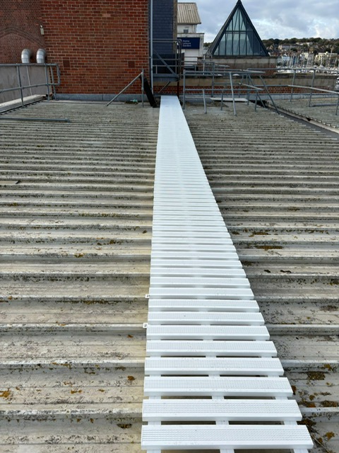 Rooftop walkway system on an industrial roof